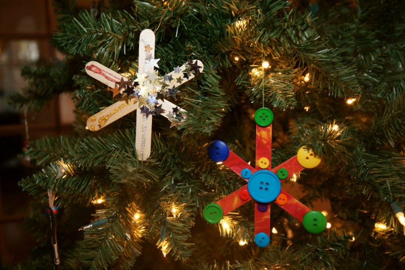 homemade popsicle snowflake ornaments on tree