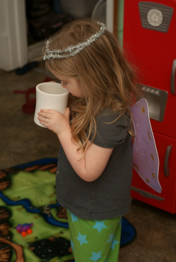 Angel Ella steals coffee